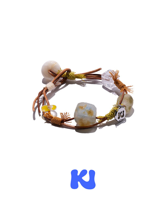 Braided rope bracelet with light gray and ivory beads plus small clear and metal charms