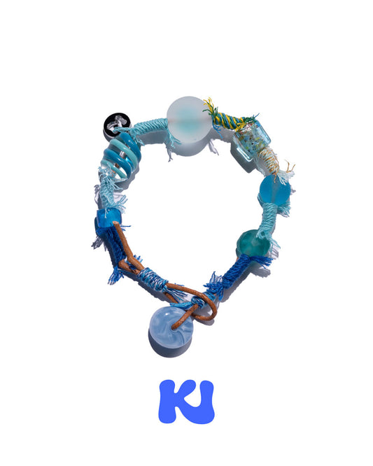 Beaded woven bracelet with blue and turquoise beads and metal charms