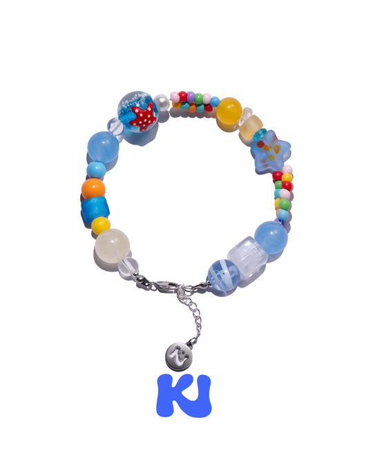 Starfish crystal beaded bracelet with light blue, yellow and rainbow beads, silver chain and starfish