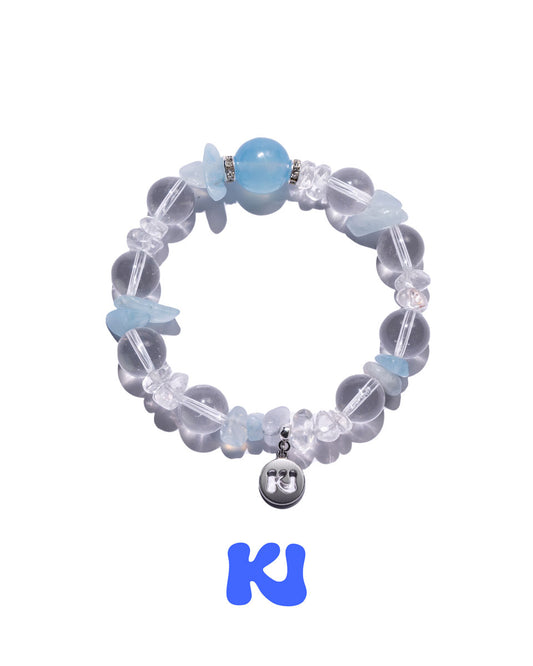 Light blue and clear bead charm bracelet with round face pendant