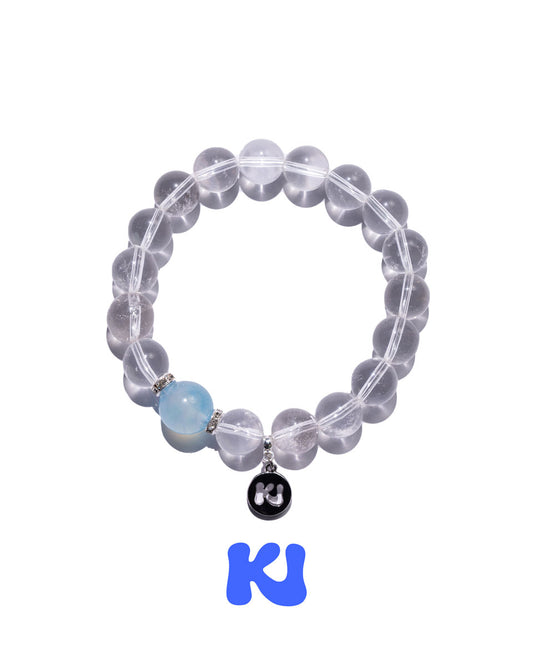 Clear beaded bracelet with light blue accent bead and black heart charm