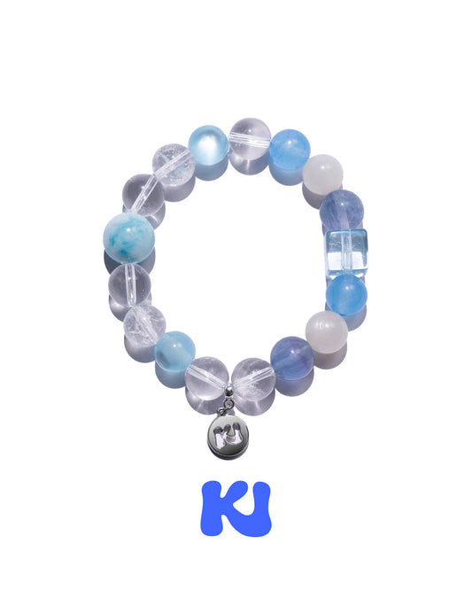 Blue and clear beaded bracelet with a small hanging heart charm