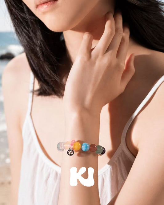 Rainbow multi-gem bead bracelet with round letter charm and clear spacer beads