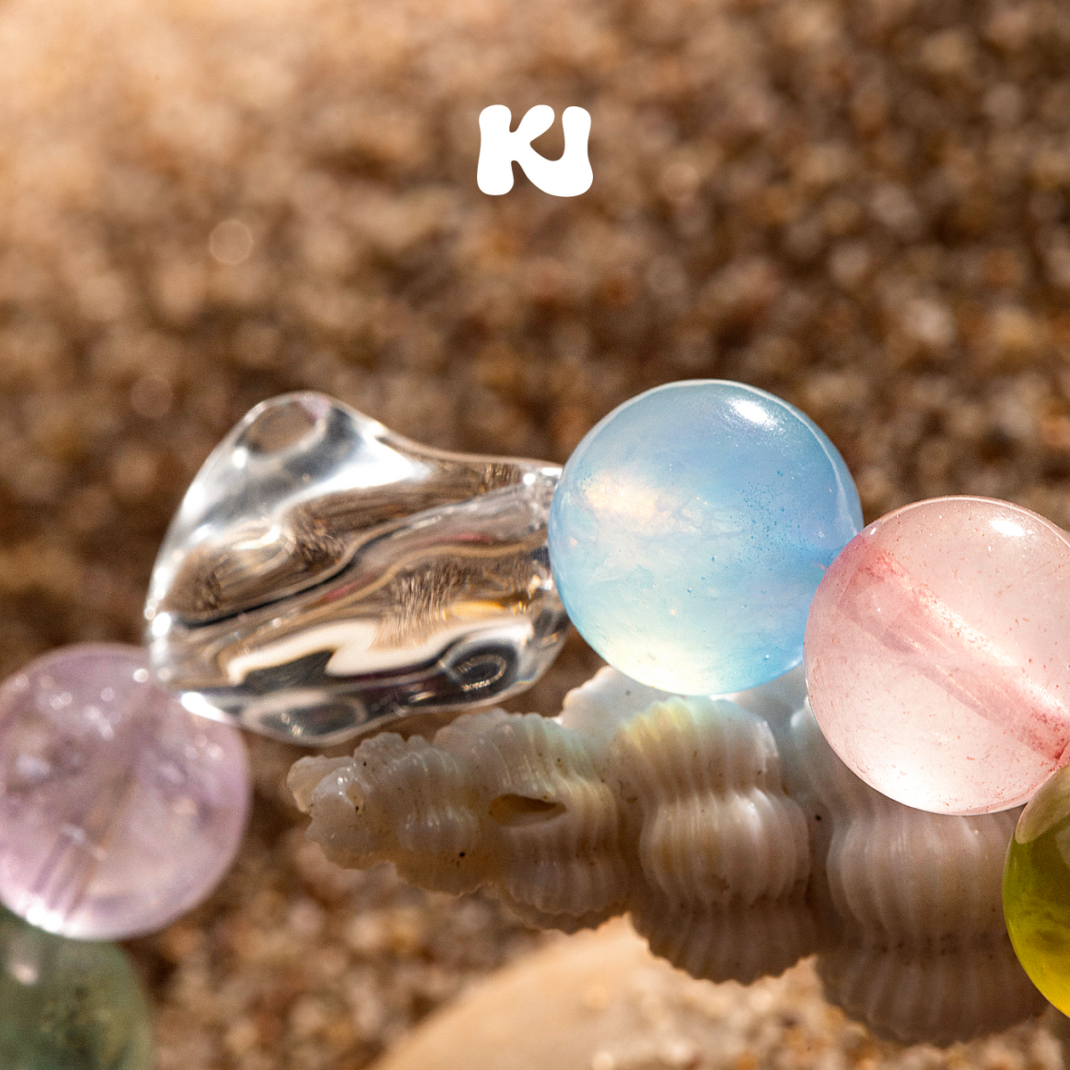 Rainbow multi-gem crystal bracelet with round pastel beads and silver-tone charm