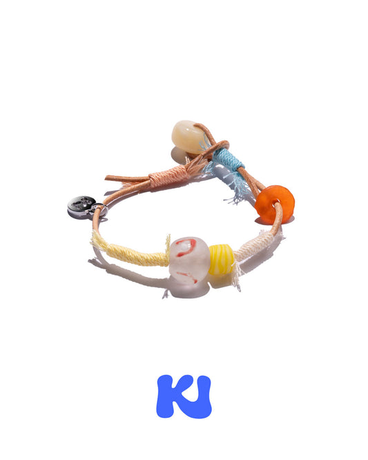 Multicolor rope bracelet with white and orange beads and braided orange, blue, and yellow ends