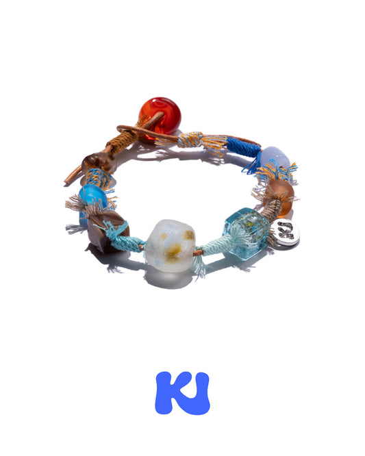 Braided charm bracelet with blue, brown, and red glass beads