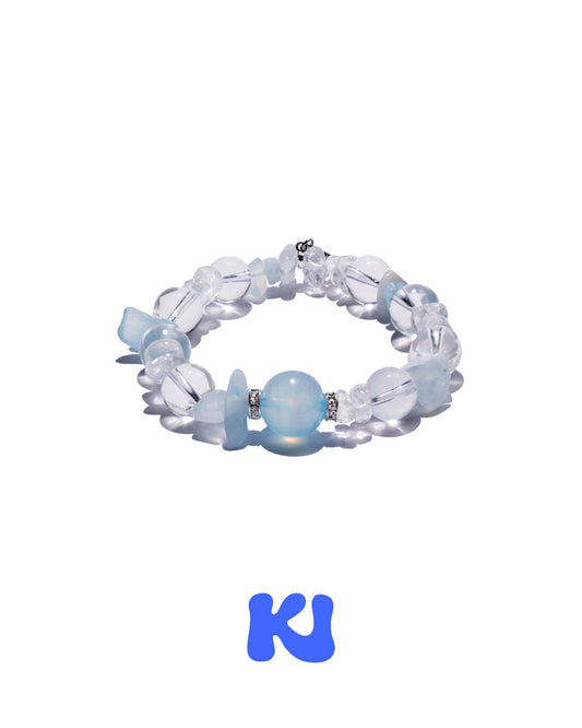 Light blue and clear beaded charm bracelet with oval and chip beads