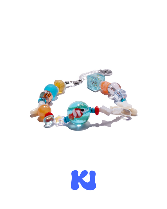 Crystal beaded bracelet with goldfish charm, multicolor glass beads, and silver clasp
