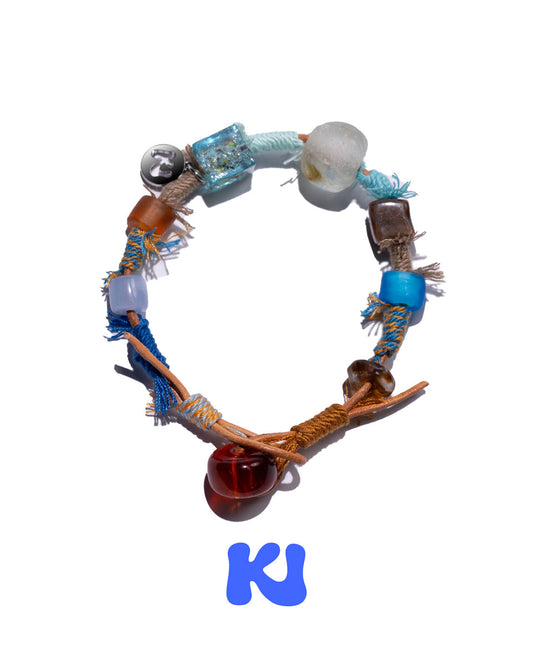 Braided charm bracelet with turquoise blue beads and silver-toned bead accents