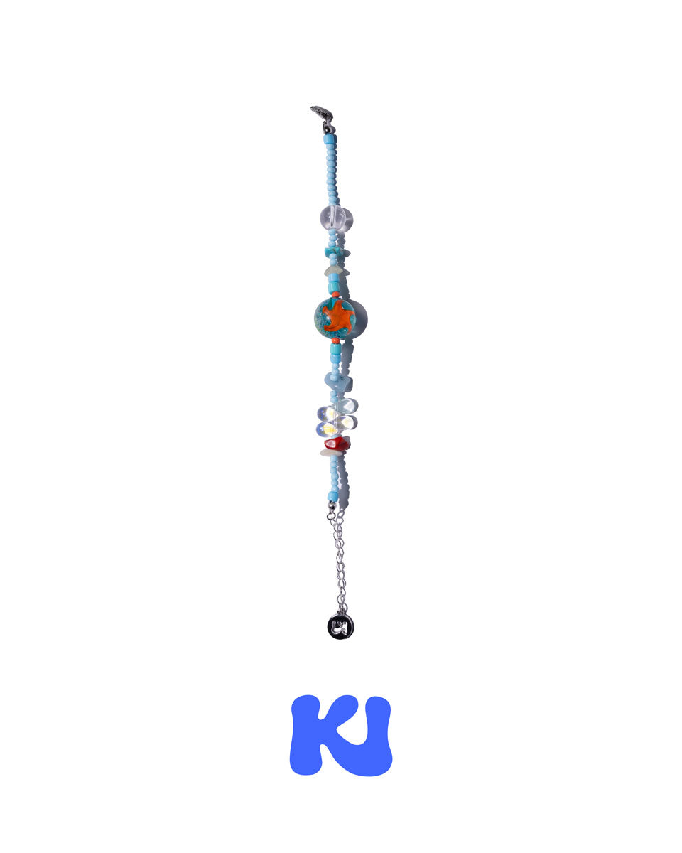 Beaded charm bracelet with blue beads, orange centerpiece bead, silver end chain