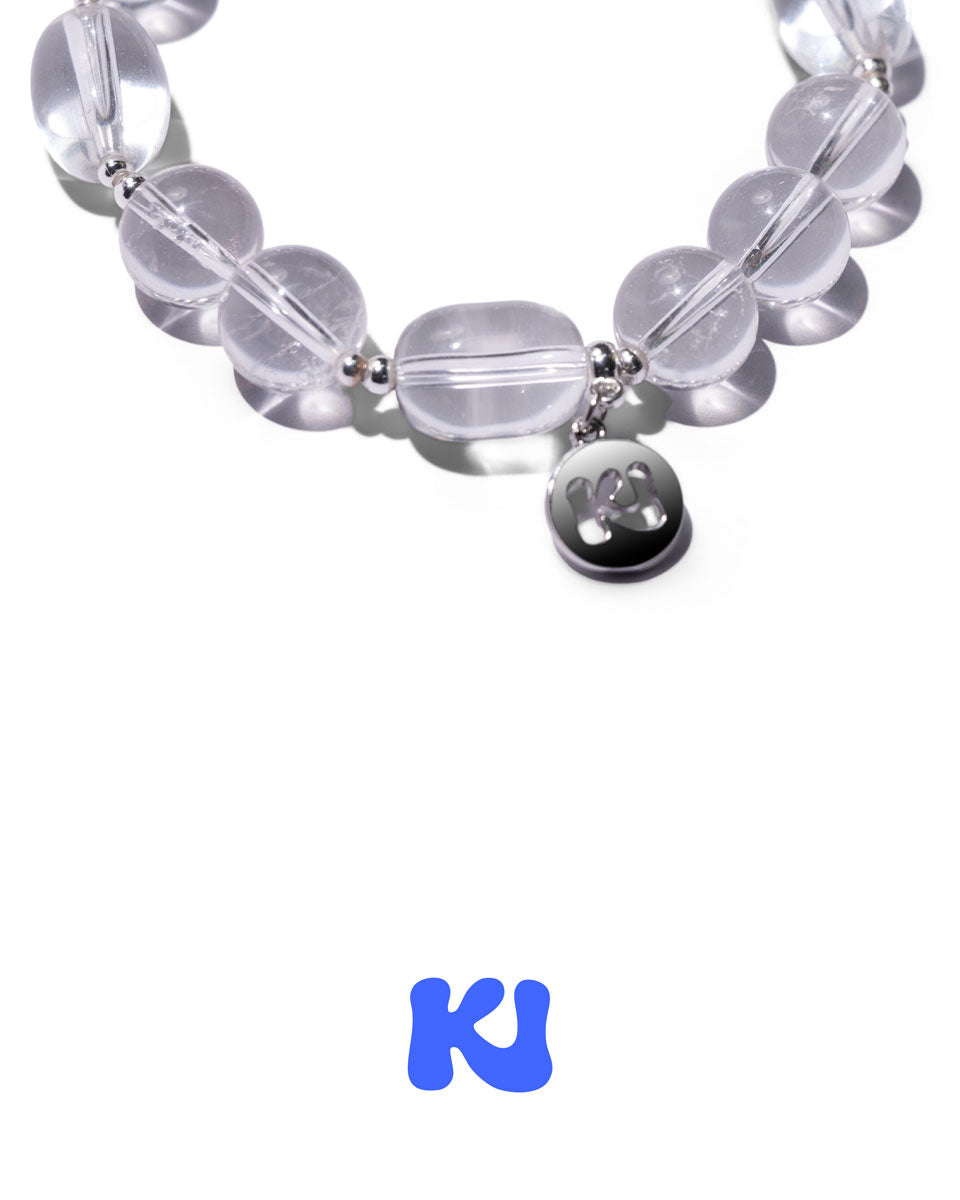Clear oval bead bracelet with black Mickey-style charm and silver-toned hardware
